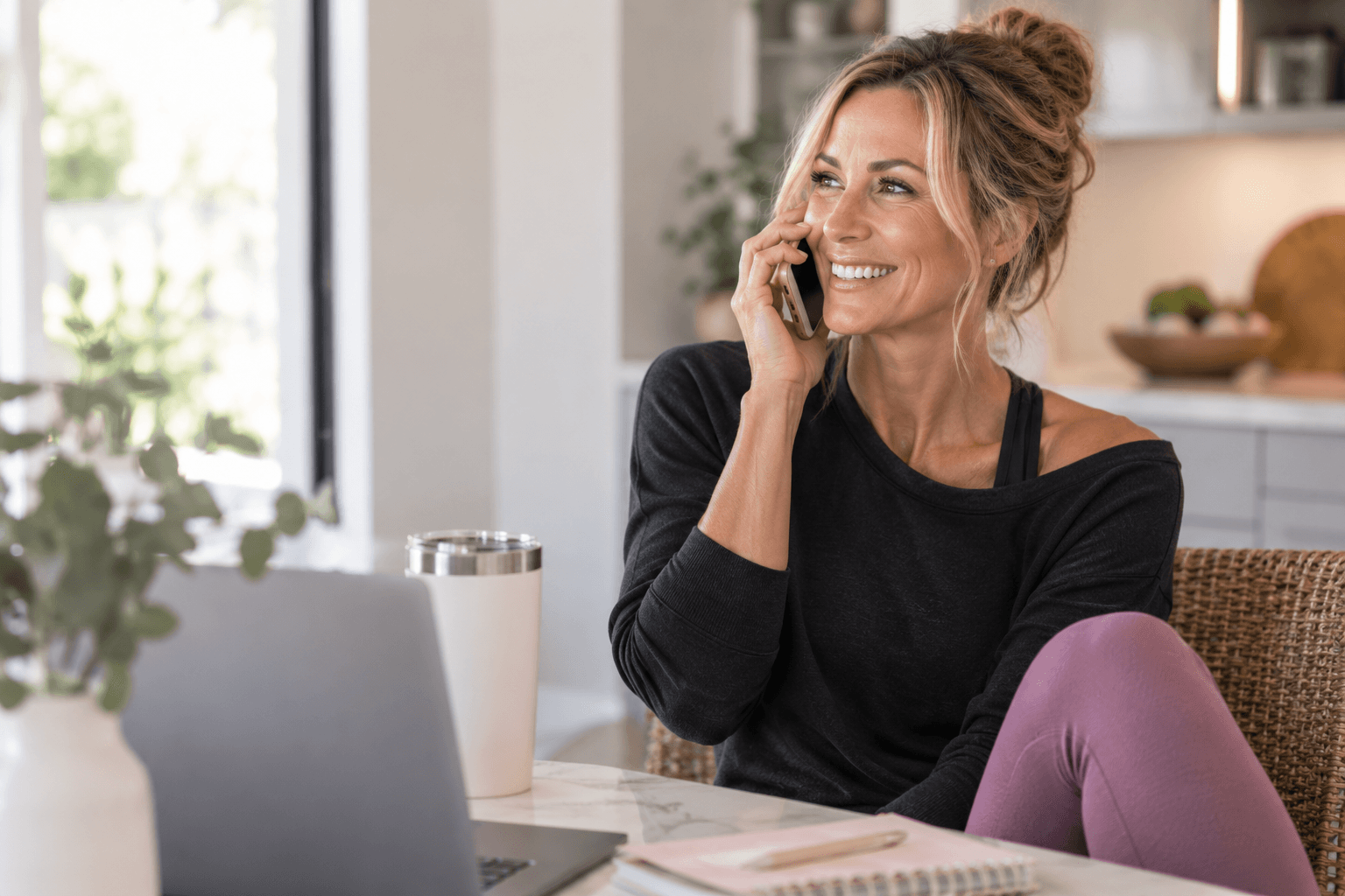 Woman talking on the phone about personal fitness coaching